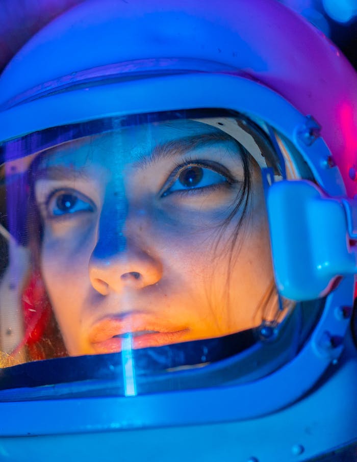 Vivid close-up of a woman in a space suit, reflecting exploration and futuristic themes.